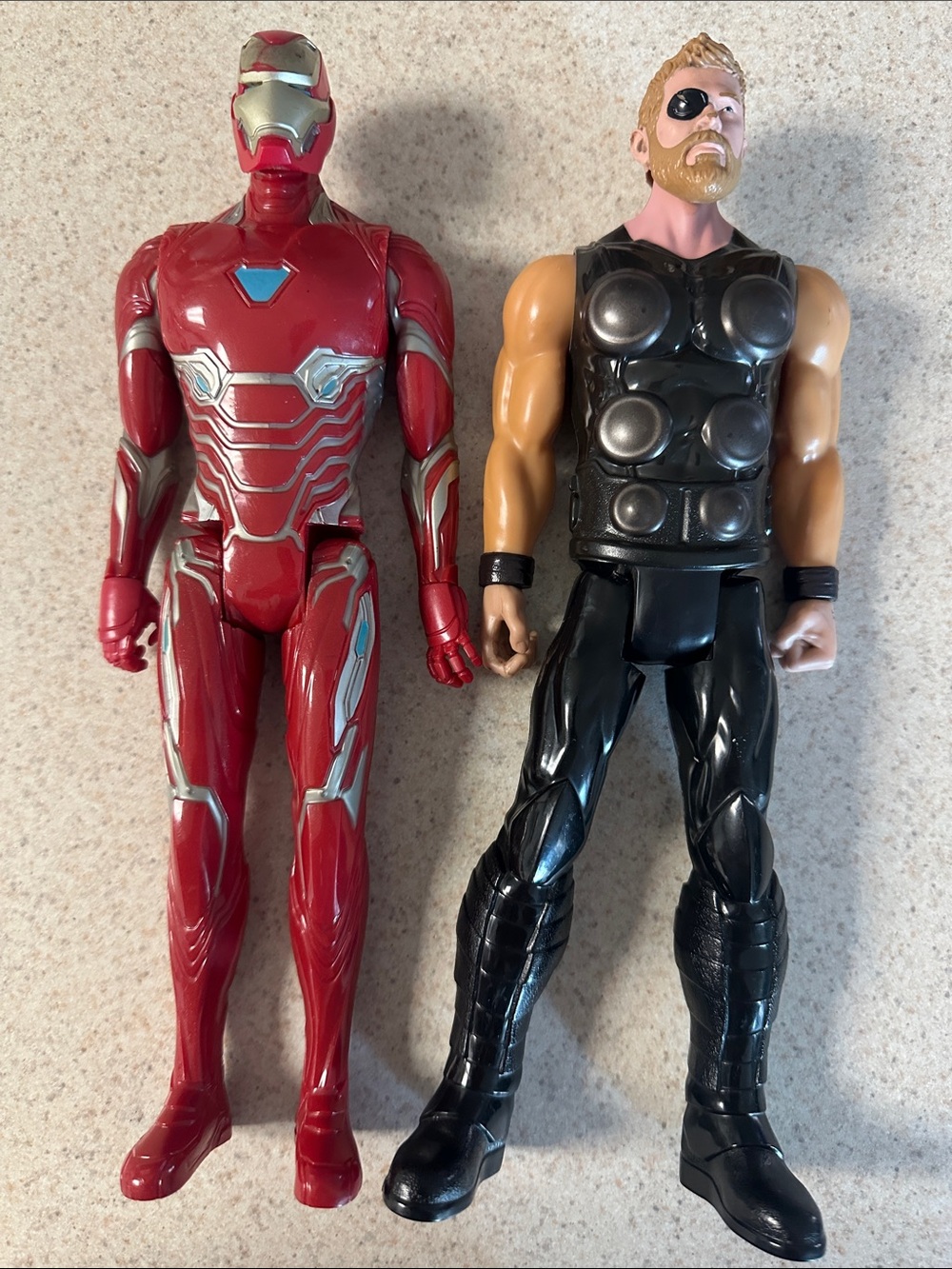 Marvel Titan Hero Series figures, specifically Iron Man and Hawkeye,